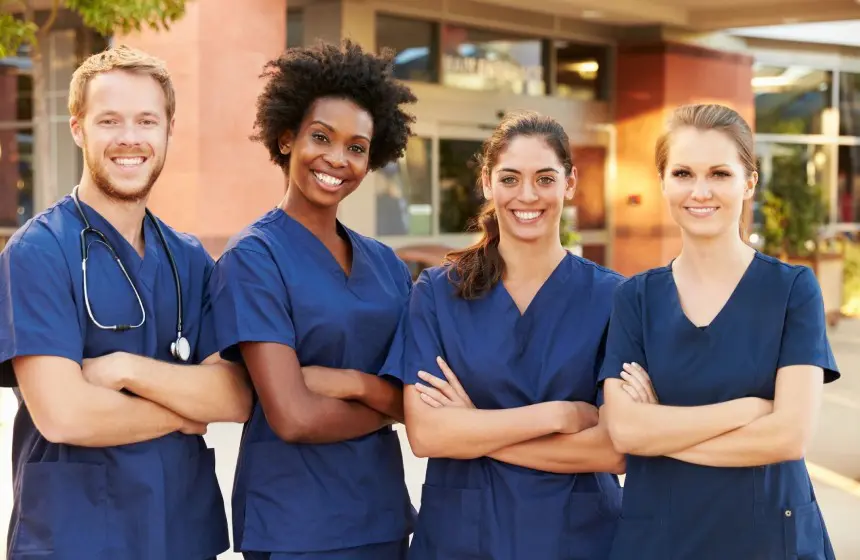 Portrait Of Medical Team Standing Outside Hospital